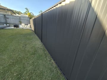 Monument Colorbond fence along a lawn